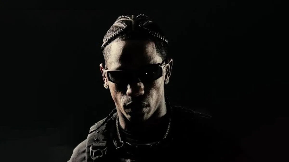 Travis Scott usando o novo óculos Oakley X-Metal Juliet em foto oficial de estúdio.